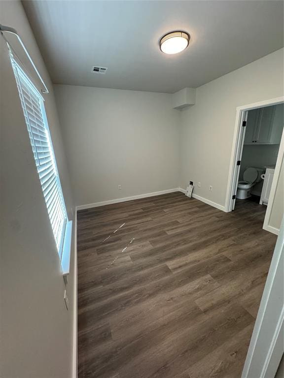 1867 Comice Dr, Newcastle, OK 73065 - unfurnished bedroom with dark wood finished floors and baseboards