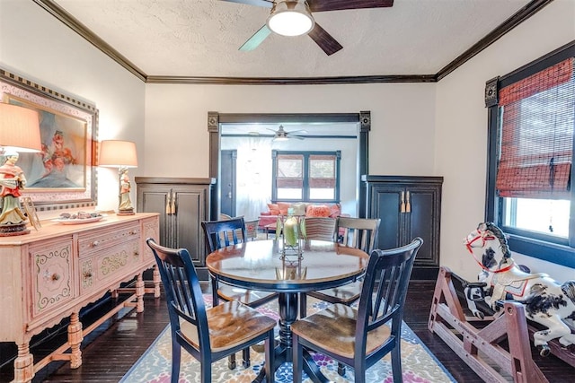 1217 NW 44th St, Oklahoma City, OK 73118 - dining area with a ceiling fan, dark wood-type flooring, plenty of natural light, crown molding, and a textured ceiling