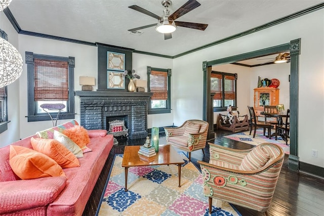 1217 NW 44th St, Oklahoma City, OK 73118 - living area with a ceiling fan, wood finished floors, a brick fireplace, crown molding, and baseboards