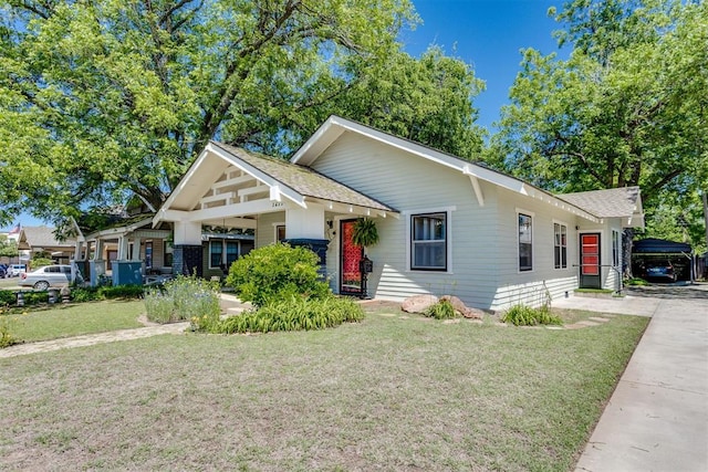 1217 NW 44th St, Oklahoma City, OK 73118 - view of front of property featuring a front yard and roof with shingles