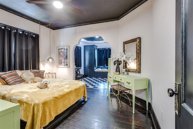 1217 NW 44th St, Oklahoma City, OK 73118 - bedroom featuring arched walkways, ornamental molding, dark wood-style floors, and ceiling fan