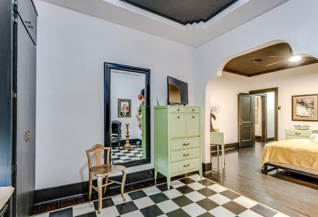 1217 NW 44th St, Oklahoma City, OK 73118 - bedroom with dark floors, arched walkways, and baseboards