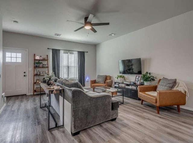 1663 Comice Dr, Newcastle, OK 73065 - living room with wood finished floors, a ceiling fan, and baseboards