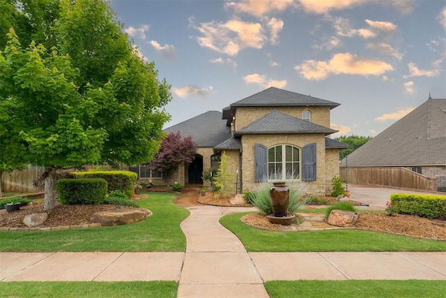 7616 NW 134th St, Oklahoma City, OK 73142 - traditional-style home featuring roof with shingles and stone siding