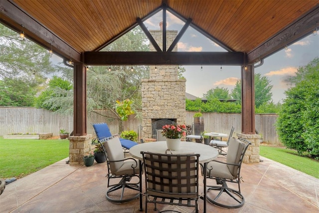 7616 NW 134th St, Oklahoma City, OK 73142 - view of patio with a gazebo, an outdoor stone fireplace, and outdoor dining space