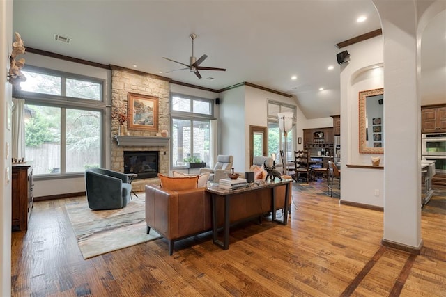 7616 NW 134th St, Oklahoma City, OK 73142 - living area featuring ornamental molding, ceiling fan, a fireplace, wood finished floors, and recessed lighting