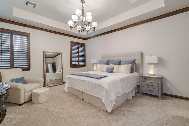 7616 NW 134th St, Oklahoma City, OK 73142 - bedroom featuring a tray ceiling, light carpet, a chandelier, multiple windows, and ornamental molding