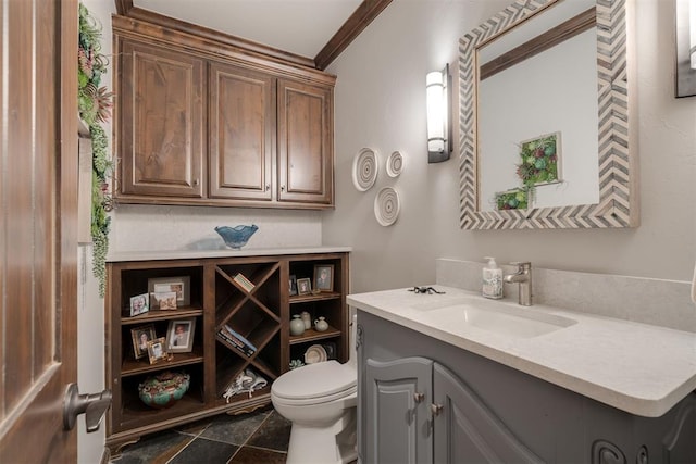 7616 NW 134th St, Oklahoma City, OK 73142 - bathroom with toilet, vanity, and ornamental molding