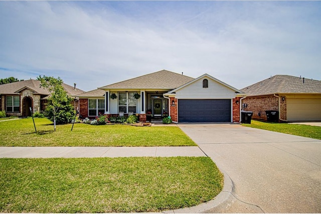 708 Ashwood Ln, Moore, OK 73160 - ranch-style house with a garage, a front yard, brick siding, and driveway