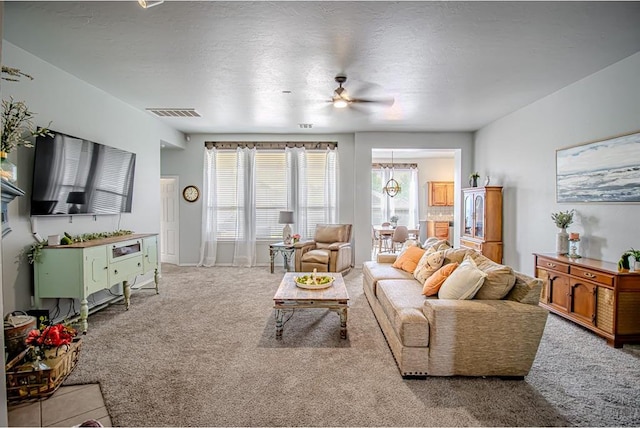 708 Ashwood Ln, Moore, OK 73160 - living room with carpet floors and a ceiling fan