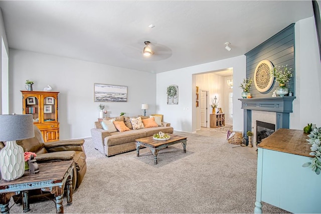 708 Ashwood Ln, Moore, OK 73160 - carpeted living area featuring a fireplace with flush hearth and a ceiling fan