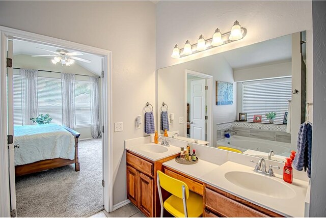 708 Ashwood Ln, Moore, OK 73160 - full bath with lofted ceiling, ensuite bath, double vanity, ceiling fan, and a jetted tub