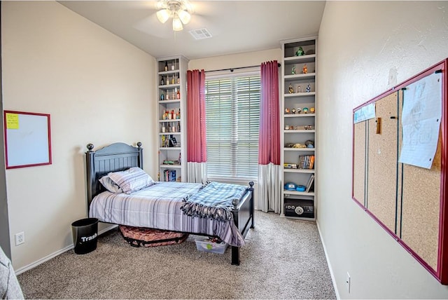 708 Ashwood Ln, Moore, OK 73160 - carpeted bedroom with baseboards and ceiling fan