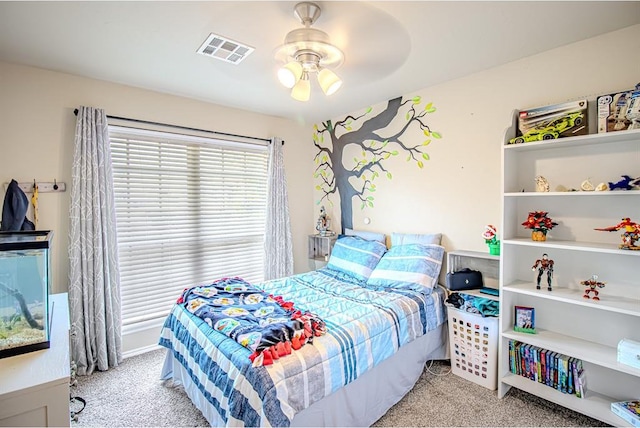 708 Ashwood Ln, Moore, OK 73160 - bedroom with light colored carpet and ceiling fan