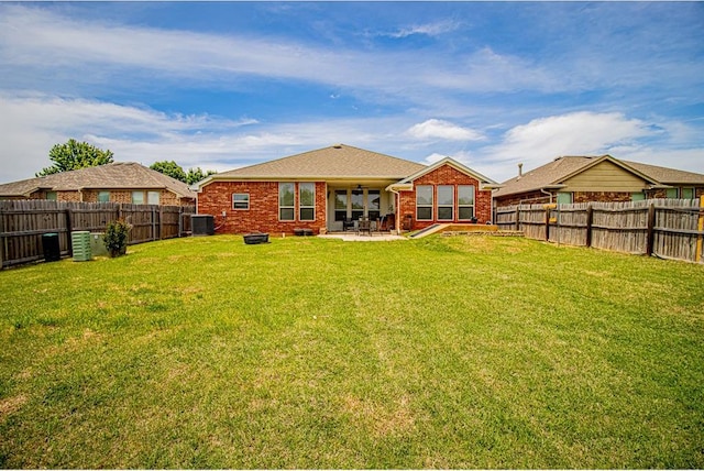 708 Ashwood Ln, Moore, OK 73160 - back of property featuring a patio, brick siding, and central air condition unit