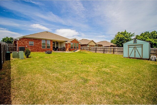 708 Ashwood Ln, Moore, OK 73160 - view of yard featuring a patio area, a shed, and an outdoor structure