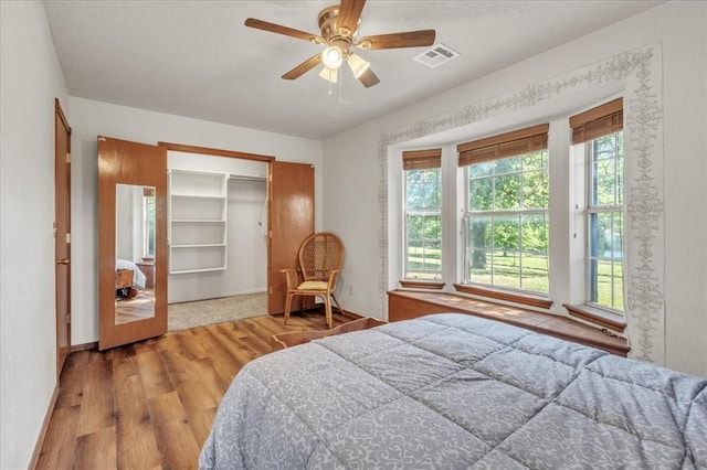 826 Stone Dr, Blanchard, OK 73010 - bedroom with wood finished floors, ceiling fan, and baseboards