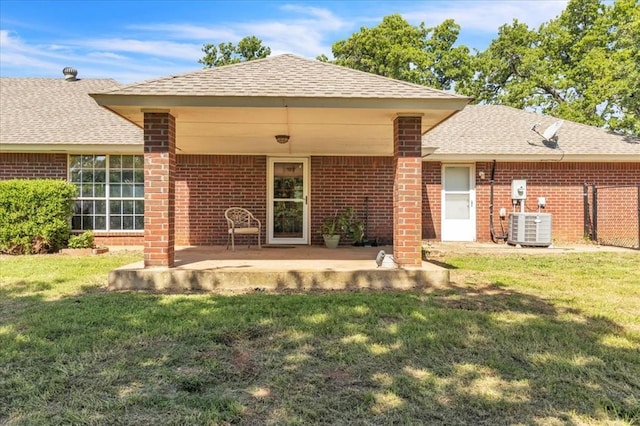 826 Stone Dr, Blanchard, OK 73010 - back of house featuring central AC unit, a yard, brick siding, and roof with shingles