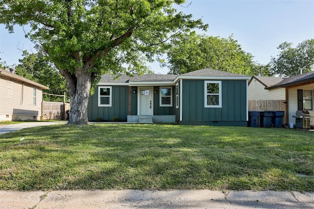 737 NW 89th St, Oklahoma City, OK 73114 - view of front facade with board and batten siding and a shingled roof