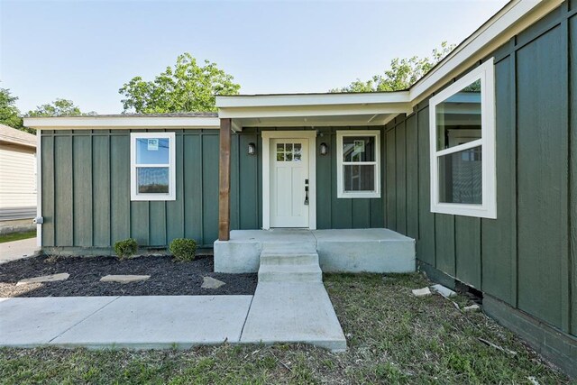 737 NW 89th St, Oklahoma City, OK 73114 - view of exterior entry with board and batten siding