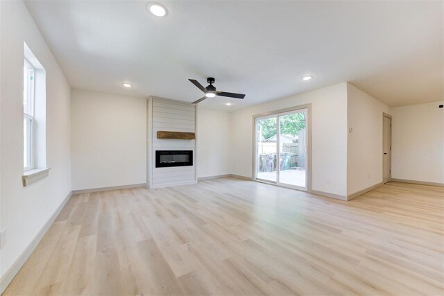 737 NW 89th St, Oklahoma City, OK 73114 - unfurnished living room featuring ceiling fan, light wood finished floors, baseboards, and recessed lighting