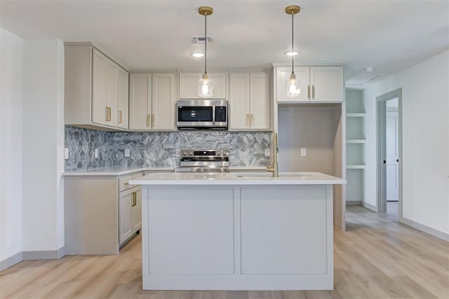 737 NW 89th St, Oklahoma City, OK 73114 - kitchen featuring appliances with stainless steel finishes, a sink, light countertops, and light wood finished floors