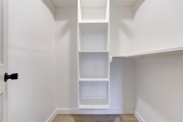 737 NW 89th St, Oklahoma City, OK 73114 - spacious closet featuring wood finished floors