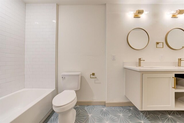737 NW 89th St, Oklahoma City, OK 73114 - full bathroom featuring toilet, vanity, and baseboards