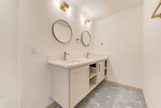 737 NW 89th St, Oklahoma City, OK 73114 - bathroom with double vanity, tile patterned floors, and baseboards