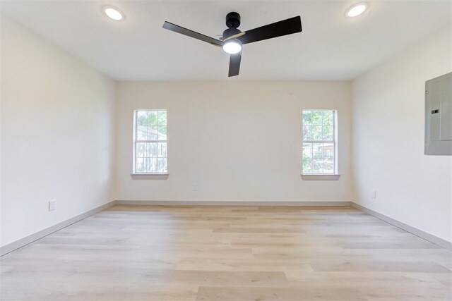 737 NW 89th St, Oklahoma City, OK 73114 - spare room with electric panel, a ceiling fan, light wood-type flooring, recessed lighting, and baseboards