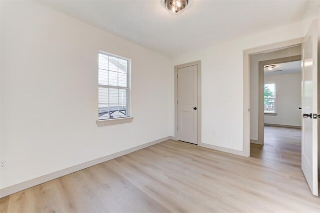 737 NW 89th St, Oklahoma City, OK 73114 - spare room with light wood-style floors and baseboards