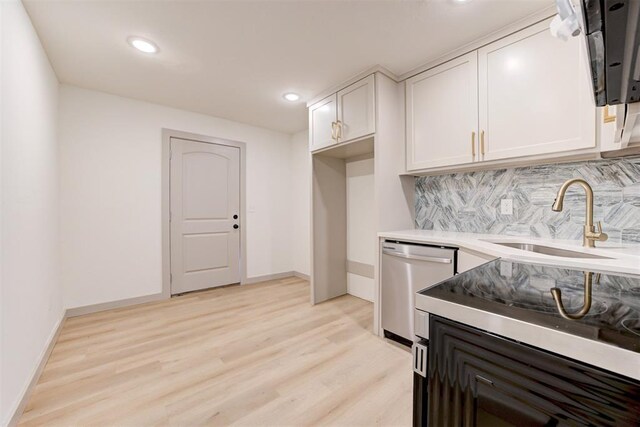 737 NW 89th St, Oklahoma City, OK 73114 - kitchen with a sink, stainless steel dishwasher, light wood-style floors, tasteful backsplash, and recessed lighting