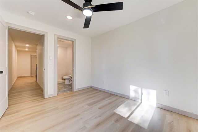 737 NW 89th St, Oklahoma City, OK 73114 - unfurnished bedroom with light wood-style flooring, baseboards, ensuite bathroom, and ceiling fan