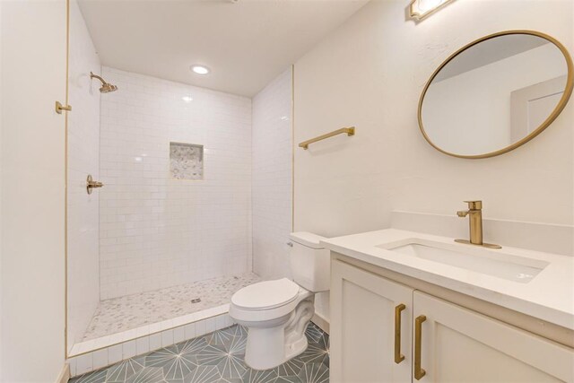737 NW 89th St, Oklahoma City, OK 73114 - bathroom with toilet, tiled shower, and vanity