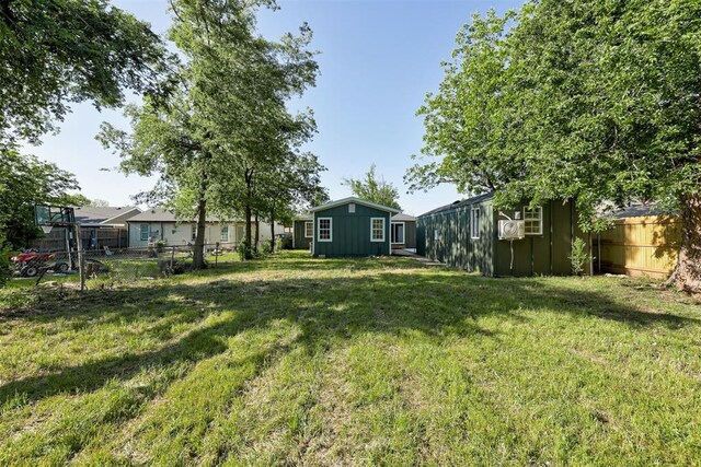 737 NW 89th St, Oklahoma City, OK 73114 - view of yard featuring an outbuilding and a storage unit