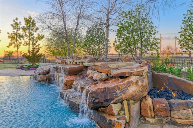 4401 Cannon Dr, Norman, OK 73072 - view of pool at dusk