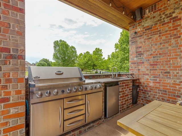4401 Cannon Dr, Norman, OK 73072 - view of patio with a sink and an outdoor kitchen