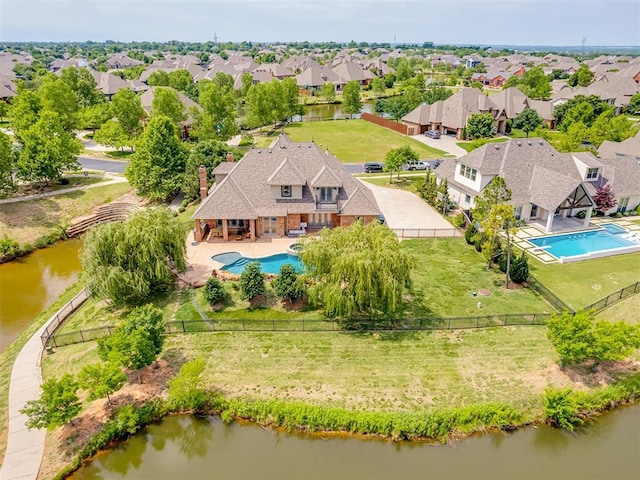 4401 Cannon Dr, Norman, OK 73072 - aerial perspective of suburban area featuring a pool area and a large body of water