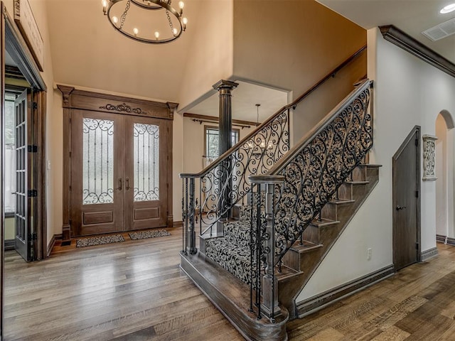 4401 Cannon Dr, Norman, OK 73072 - foyer with a high ceiling, french doors, wood finished floors, healthy amount of natural light, and stairway