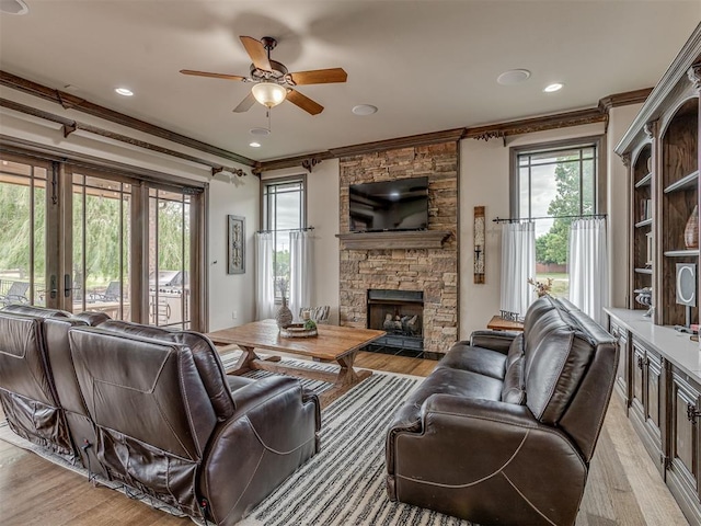 4401 Cannon Dr, Norman, OK 73072 - living room with light wood-type flooring, crown molding, ceiling fan, a fireplace, and recessed lighting