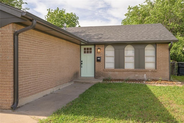 121 NW 79th St, Oklahoma City, OK 73114 - entrance to property featuring brick siding, a yard, and a shingled roof