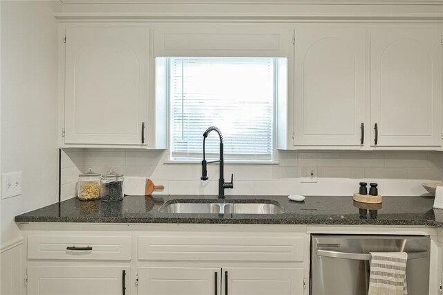 121 NW 79th St, Oklahoma City, OK 73114 - kitchen with dishwasher, a sink, white cabinets, and backsplash
