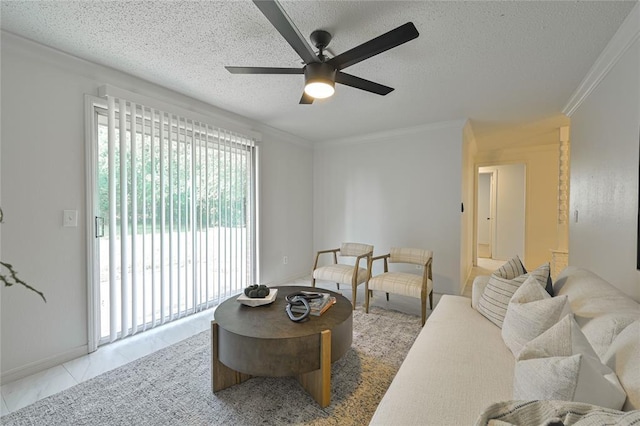 121 NW 79th St, Oklahoma City, OK 73114 - tiled living area with a ceiling fan, ornamental molding, a textured ceiling, and baseboards