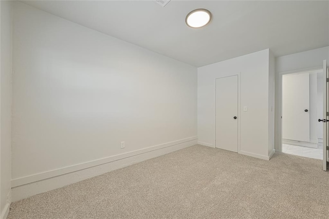 121 NW 79th St, Oklahoma City, OK 73114 - unfurnished bedroom featuring baseboards and light carpet
