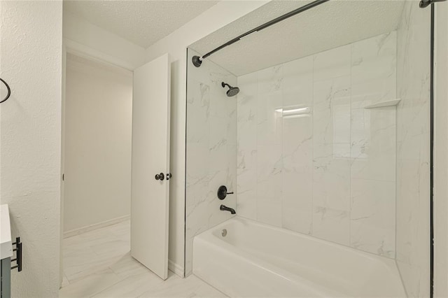 121 NW 79th St, Oklahoma City, OK 73114 - bathroom featuring marble finish floors, shower / washtub combination, and a textured ceiling
