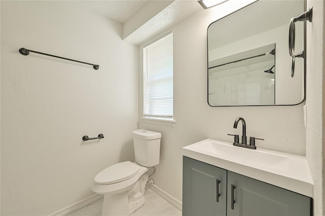 121 NW 79th St, Oklahoma City, OK 73114 - bathroom with toilet, baseboards, vanity, and a textured ceiling