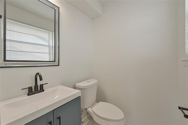121 NW 79th St, Oklahoma City, OK 73114 - bathroom with toilet, vanity, and baseboards