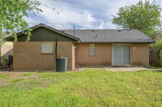 121 NW 79th St, Oklahoma City, OK 73114 - rear view of house with central air condition unit, brick siding, a patio area, and a shingled roof