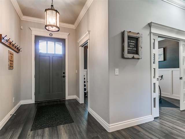 4133 Carmina Dr, Edmond, OK 73034 - foyer entrance featuring dark wood finished floors, ornamental molding, baseboards, and a chandelier