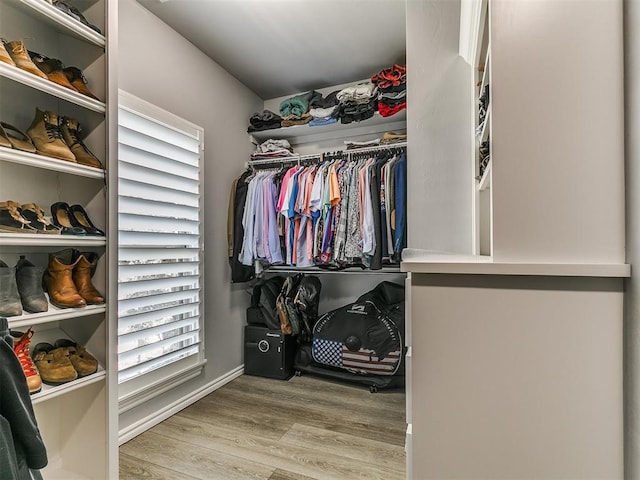 4133 Carmina Dr, Edmond, OK 73034 - walk in closet with wood finished floors